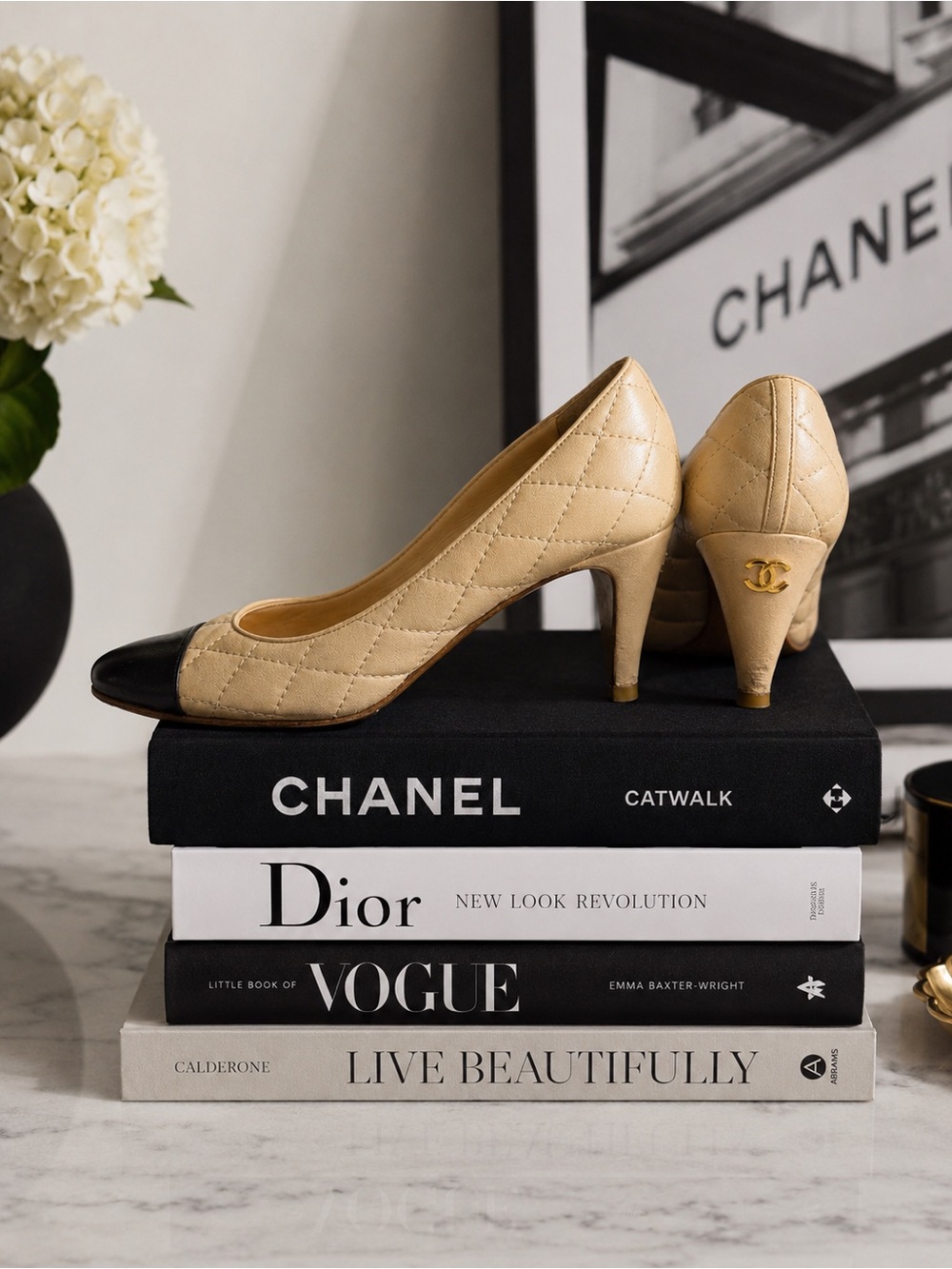 CHANEL Quilted Cap Toe CC Pumps in Beige & Black Leather